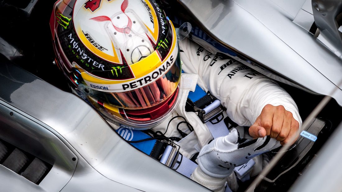 lewis hamilton in race car with his helmet. Image by Jaffa The Cake