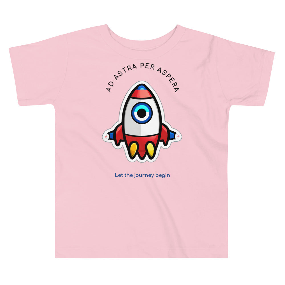 pink rocketship t-shirt on white surface