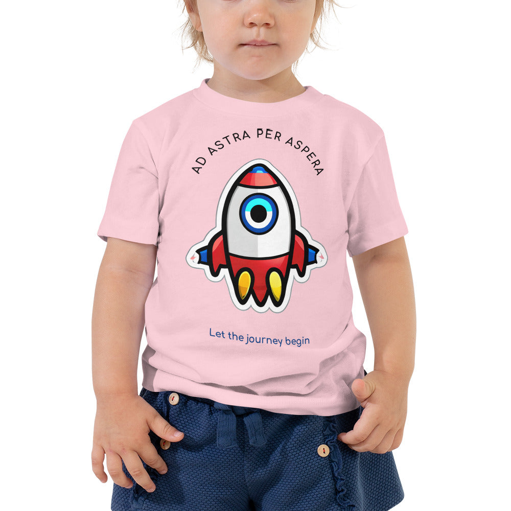 young girl wearing pink shirt with rounded rocketship and the words Ad Astra Per Aspera on the top
