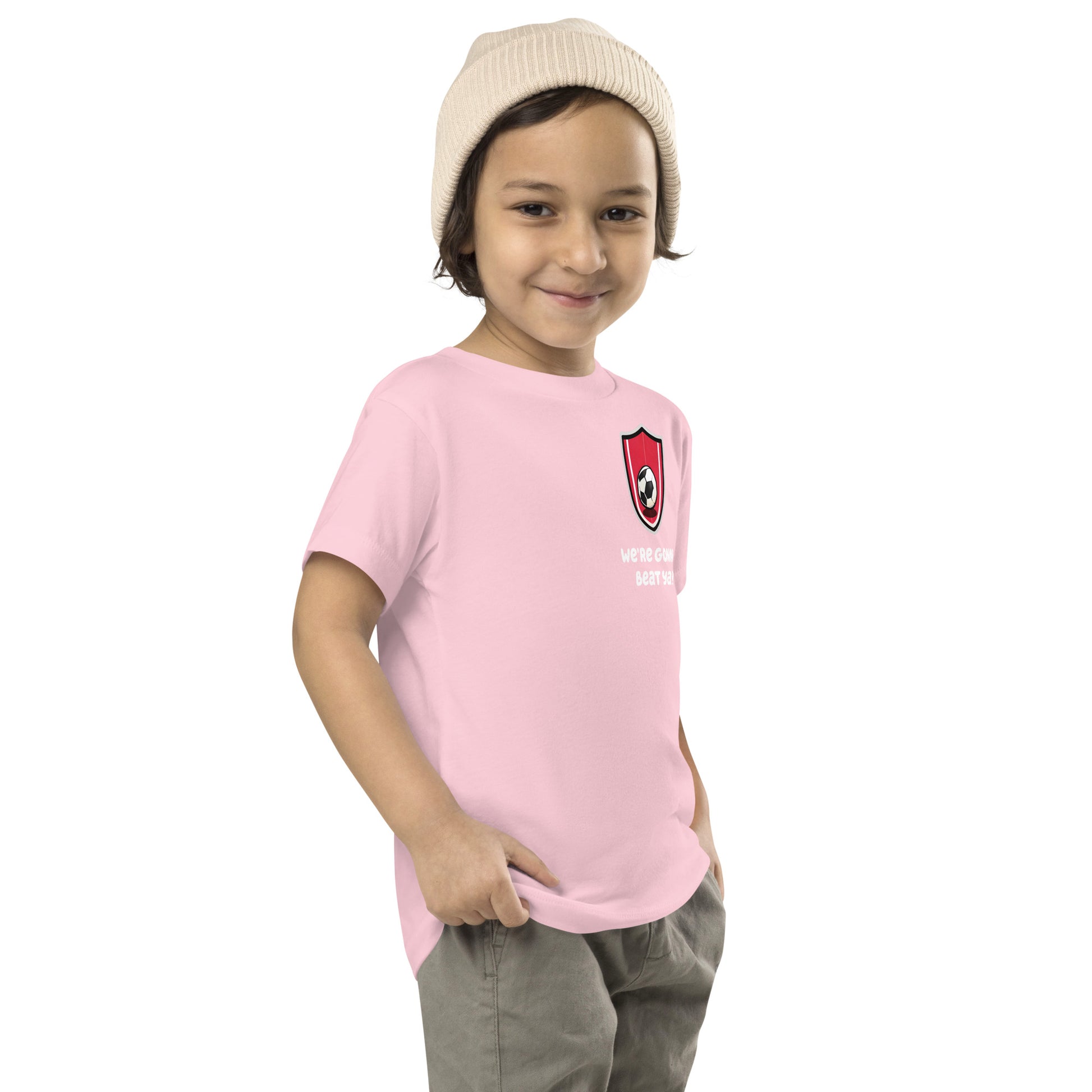 boy smirking while wearing Bluey Team Mom pink shirt