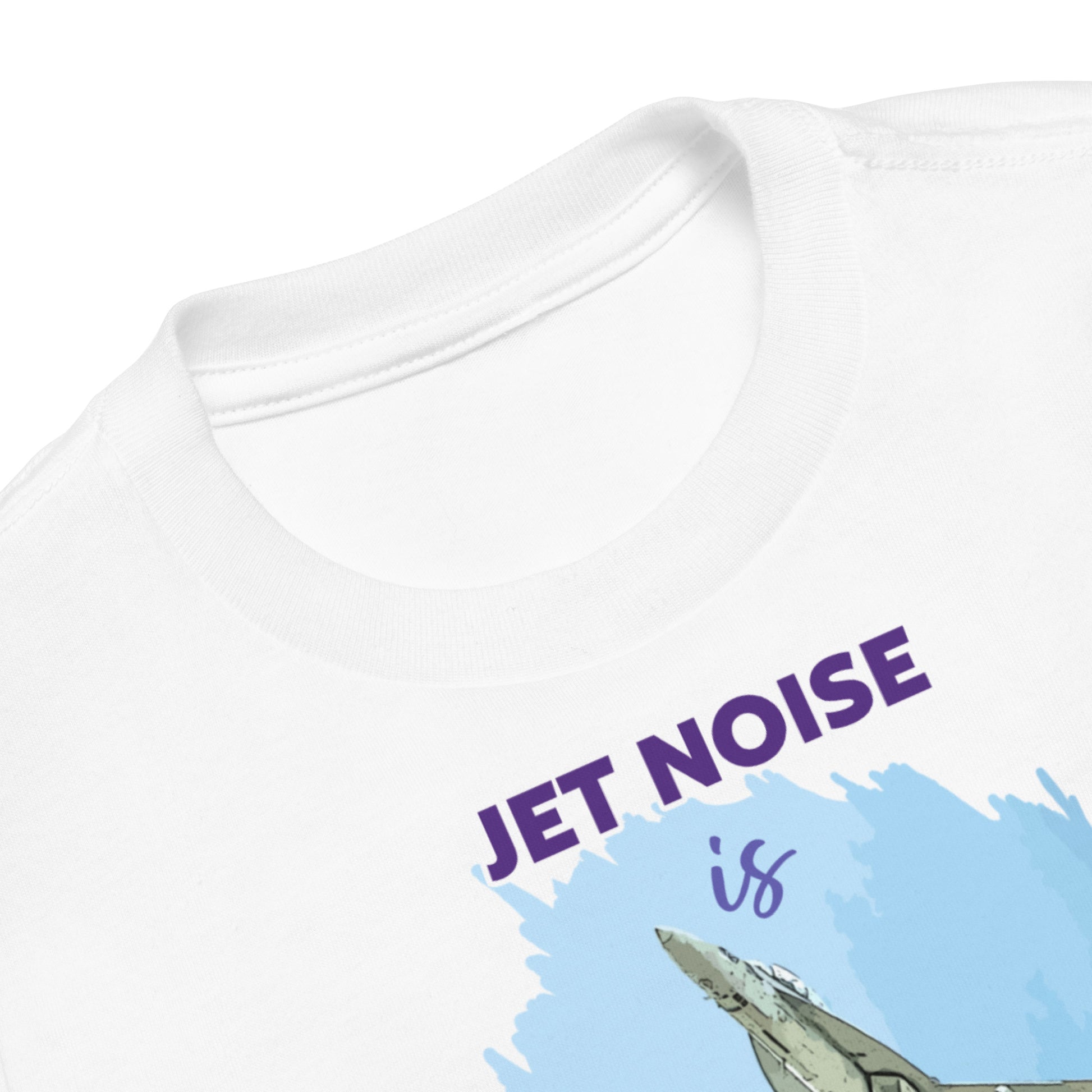 closeup of t-shirt showing Jet Noise is. Also showing the nose of the jet fighter