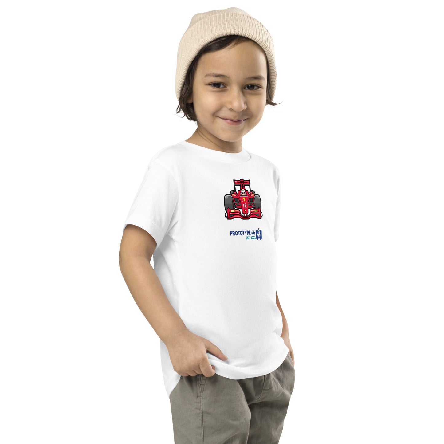 boy smirking while wearing F1 shirt with red race car design