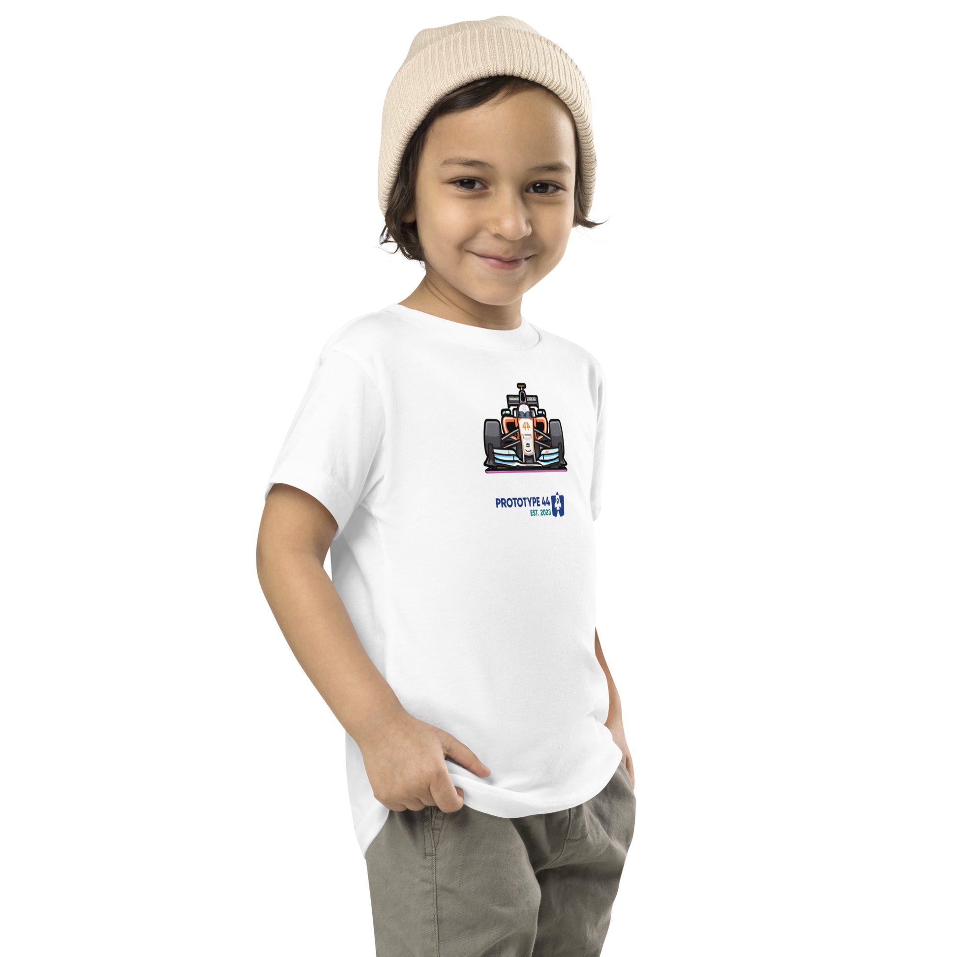 boy smirking while wearing F1 shirt for toddlers for McLaren team