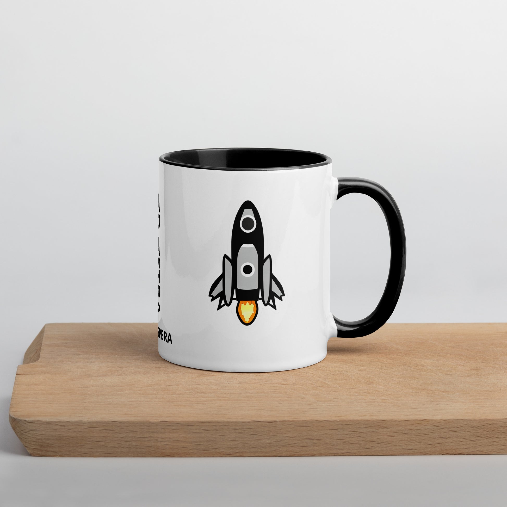side view of mug showing another rocketship