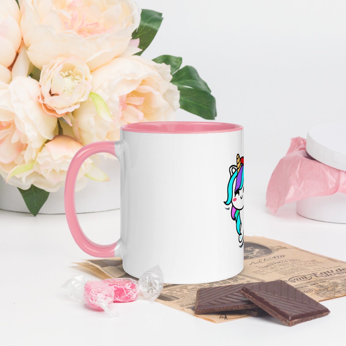 side view of white coffee mug with pink handle